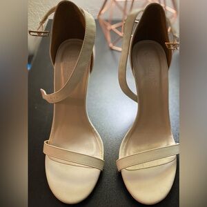 White heel, worn once, comfortable and would go with any outfit for any occasion